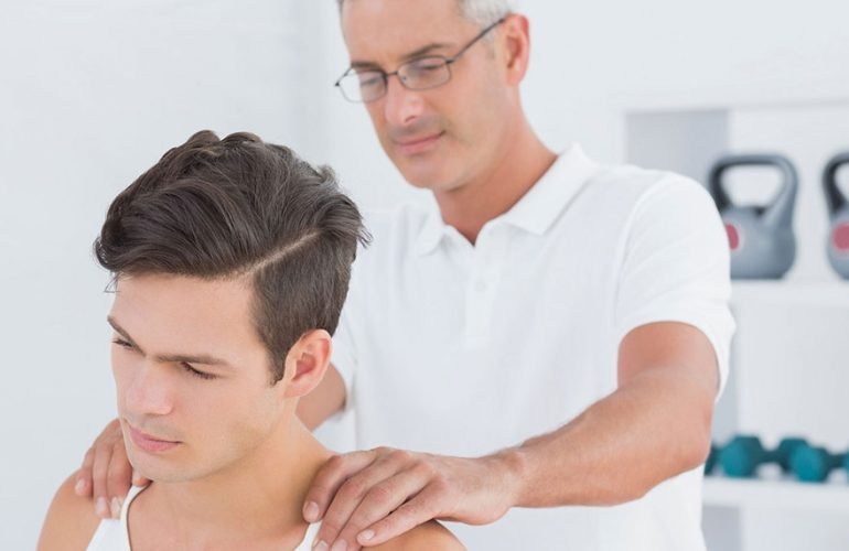 A physiotherapist demonstrating neck stretches to a patient suffering from mild neck pain. The patient sits upright with a relaxed posture, following proper ergonomic guidelines.