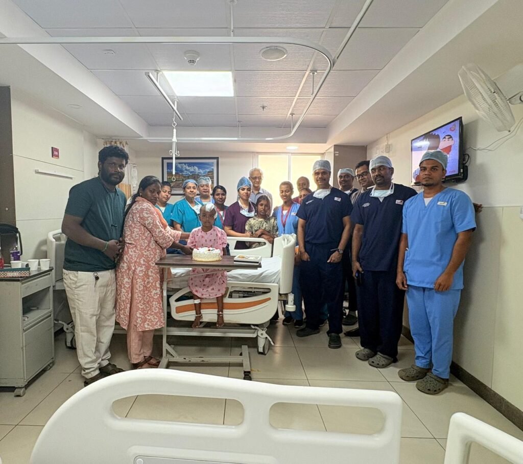 Hospital team celebrating successful pediatric extradural hematoma surgery recovery