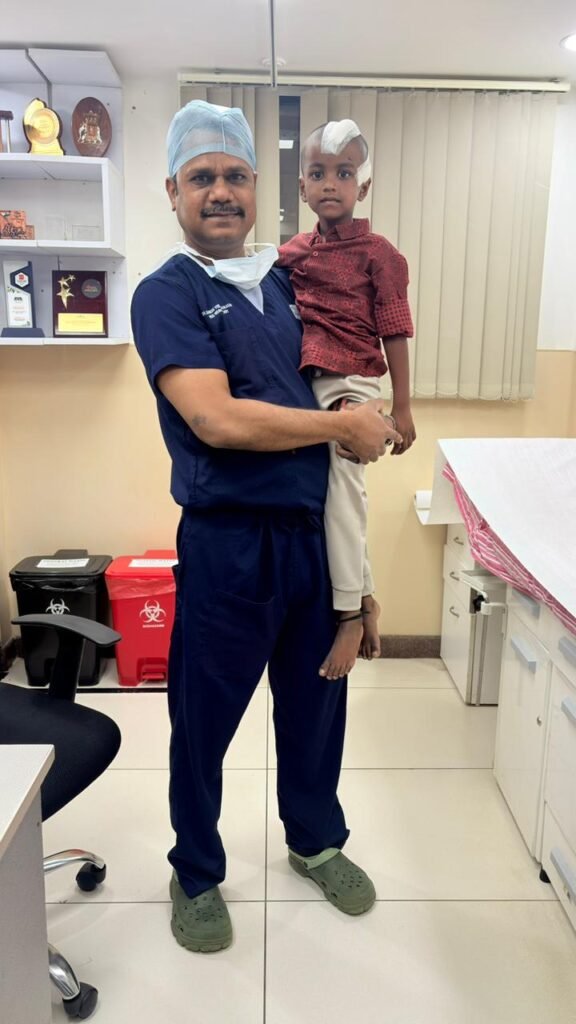 Pediatric neurosurgeon in Bengaluru with child after successful brain surgery