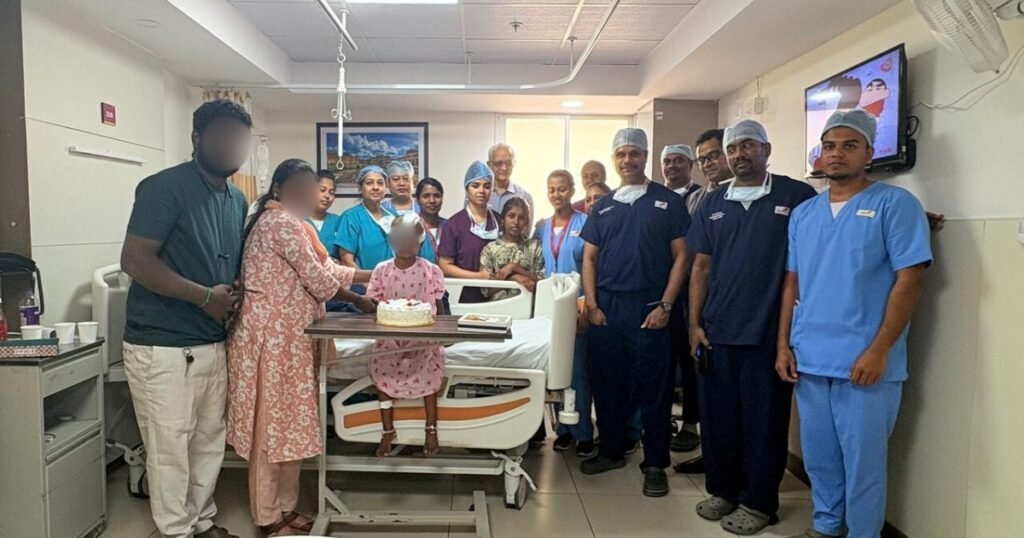 Hospital team celebrating successful pediatric extradural hematoma surgery recovery